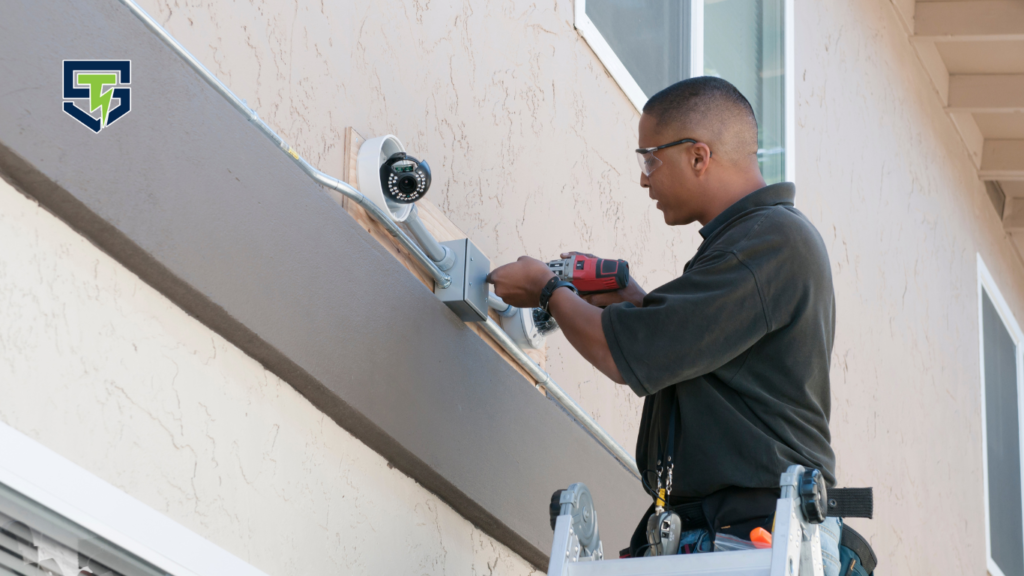 Electrician setting home security camera